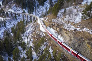 Aerial view of the famous Bernina Express passing over the Landwasser Viaduct Aerial view of the famous Bernina Express passing over the Landwasser Viaduct