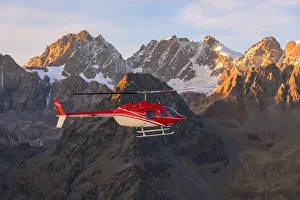 Aerial view of helicopter in flight on peaks of the Bernina Group, border of Italy Aerial view of helicopter in flight on peaks of the Bernina Group, border of Italy