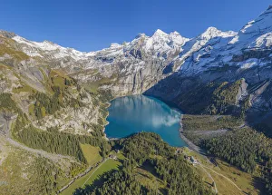 Aerial view on Lake Oeschinen with Blumlisalp mountain range, Kandersteg, Berner Oberland Aerial view on Lake Oeschinen with Blumlisalp mountain range, Kandersteg, Berner Oberland