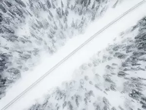 Finland Collection: Aerial view of road in the snow covered forest, Pallas-Yllastunturi National Park