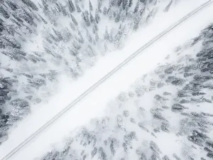 Aerial view of road in the snow covered forest, Pallas-Yllastunturi National Park Aerial view of road in the snow covered forest, Pallas-Yllastunturi National Park