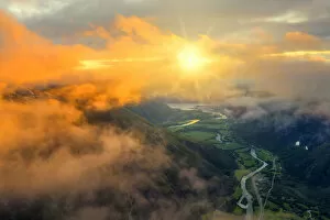 Norway Collection: Aerial view of sun rays in the sunset sky lighting up the clouds over Romsdalen valley