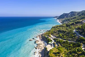 Aerial view of the winding road to Megali Petra beach. Lefkada, Ionian Islands region Aerial view of the winding road to Megali Petra beach. Lefkada, Ionian Islands region