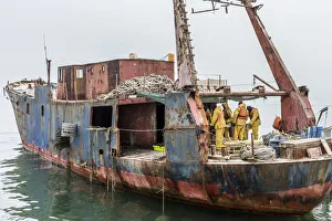 Africa, Namibia, Walvis Bay. Fishermen on a boat Africa, Namibia, Walvis Bay. Fishermen on a boat