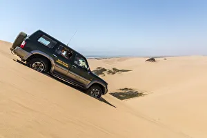 Africa, Namibia, Walvis Bay. Jeep safari on a dune Africa, Namibia, Walvis Bay. Jeep safari on a dune