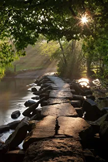 Ancient clapper bridge Tarr Steps spanning the River Barle in Exmoor, Somerset, England Ancient clapper bridge Tarr Steps spanning the River Barle in Exmoor, Somerset, England
