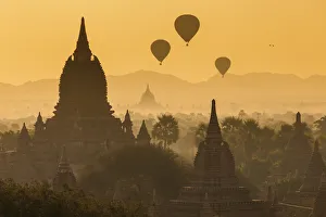 Ancient temple city of Bagan (Pagan) & balloons at sunrise, Myanmar (Burma) Ancient temple city of Bagan (Pagan) & balloons at sunrise, Myanmar (Burma)