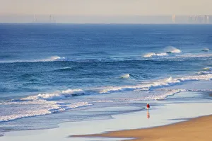 Australia, Queensland, Sunshine beach, man walking on beach Australia, Queensland, Sunshine beach, man walking on beach