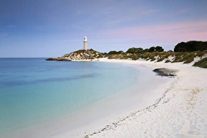 Australia, Western Australia, Rottnest Island. View along Pinky Beach to Bathurst lighthouse at dusk Australia, Western Australia, Rottnest Island. View along Pinky Beach to Bathurst lighthouse at dusk