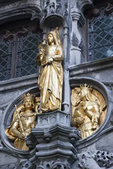 Belgium, Brugge, Facade of the Holy Blood Church, Golden Figure Belgium, Brugge, Facade of the Holy Blood Church, Golden Figure