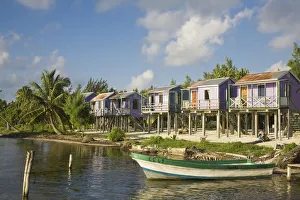 Belize, Caye Caulker, Wooden beach cabanas on stilts Belize, Caye Caulker, Wooden beach cabanas on stilts