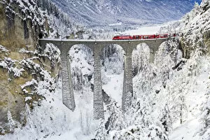 Rail Transportation Collection: Bernina Express train on Landwasser viaduct in winter, Filisur, canton of Graubunden