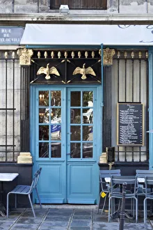 Blue doors of cafe, Marais District, Paris, France Blue doors of cafe, Marais District, Paris, France