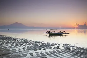 Boat on Sanur beach at dawn, Bali, Indonesia Boat on Sanur beach at dawn, Bali, Indonesia