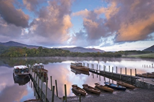 Boats on Derwent Water at sunrise, Keswick, Lake District, Cumbria, England. Autumn Boats on Derwent Water at sunrise, Keswick, Lake District, Cumbria, England. Autumn