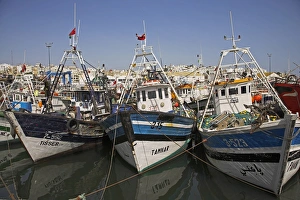 Boats moored in the busy fishing port in Tangier, Morocco Boats moored in the busy fishing port in Tangier, Morocco