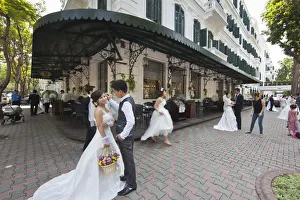 Brides and Grooms being photographed infront of the Sofitel Metropole Legend Hotel Brides and Grooms being photographed infront of the Sofitel Metropole Legend Hotel