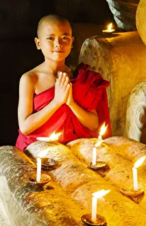A buddhist monk praying in the temple, Bagan, Burma/ Myanmar A buddhist monk praying in the temple, Bagan, Burma/ Myanmar