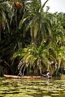 Burundi. Locals fish on the The Lac des Oiseaux which is home to numerous species Burundi. Locals fish on the The Lac des Oiseaux which is home to numerous species