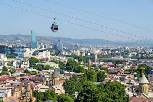 Georgia Collection: Cable car between Rike Park and the Narikala fortress passes above buildings in central