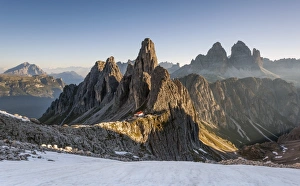 The Cadini di Misurina peaks are shot as the sun is rising in the Dolomites, with The Cadini di Misurina peaks are shot as the sun is rising in the Dolomites, with