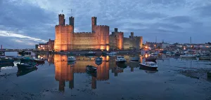 Caernarfon Castle at dusk Gwynedd, Wales Caernarfon Castle at dusk Gwynedd, Wales
