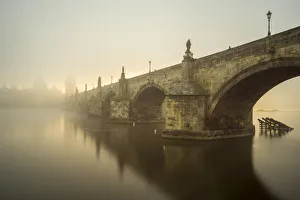 Prints of Charles Bridge with mist at sunrise, Prague, Bohemia, Czech Republic Czech Republic Prints: Charles Bridge Print at Sunrise, Prague, Czech Republic