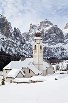 The church and village of Colfosco in Badia (1645m) and Sella Massif range of Mountains The church and village of Colfosco in Badia (1645m) and Sella Massif range of Mountains