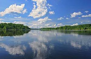 Clouds Reflected In Water Prints: Clouds reflected in the English River, Ear Falls, Ontario, Canada