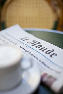 Coffee and newspaper in a cafe, Paris, France Coffee and newspaper in a cafe, Paris, France