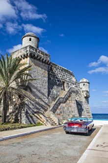 Cojimar Fort and 1959 Dodge Custom Loyal Lancer Convertible, Cojimar, Havana, Cuba (MR) Cojimar Fort and 1959 Dodge Custom Loyal Lancer Convertible, Cojimar, Havana, Cuba (MR)