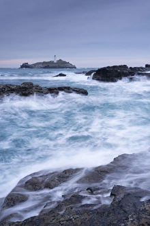 Crashing Atlantic waves near Godrevy Lighthouse, Cornwall, England. Winter (February) Crashing Atlantic waves near Godrevy Lighthouse, Cornwall, England. Winter (February)