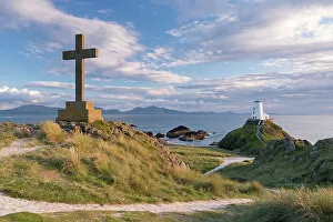 September Collection: Cross and lighthouse on Llanddwyn Island, Anglesey, Wales. Autumn (September)