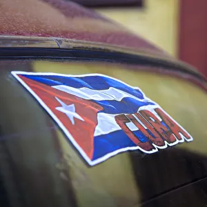 Cuban flag on car windscreen, Havana, Cuba Cuban flag on car windscreen, Havana, Cuba