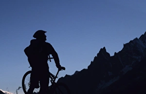 A cyclist on a mountain bike tour of Mont Blanc A cyclist on a mountain bike tour of Mont Blanc