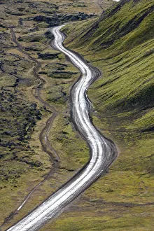 Dirt road & moss covered mountains, Landmannalaugar, Southern Highlands, Iceland Dirt road & moss covered mountains, Landmannalaugar, Southern Highlands, Iceland