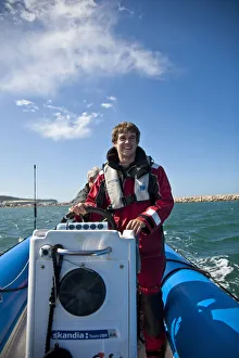 Dorset, England. Sailing coach Ian Martin prepares a course for the GBR 29ers sailing Dorset, England. Sailing coach Ian Martin prepares a course for the GBR 29ers sailing