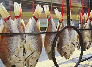 Dried fish hanging on street railing, Des Voeux Road West, Sheung Wan, Hong Kong, China Dried fish hanging on street railing, Des Voeux Road West, Sheung Wan, Hong Kong, China