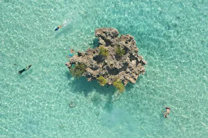 a drone shot to capture some people snorkeling around Crystal Rock, Le Morne Brabant a drone shot to capture some people snorkeling around Crystal Rock, Le Morne Brabant