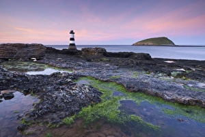Dusk over Penmon Point Lighthouse and Puffin Island, Isle of Anglesey, Wales, UK. Spring Dusk over Penmon Point Lighthouse and Puffin Island, Isle of Anglesey, Wales, UK. Spring