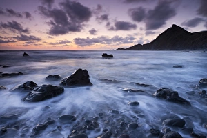 Dusk on the rocky shores of Spekes Mill Mouth in North Devon, England. Summer Dusk on the rocky shores of Spekes Mill Mouth in North Devon, England. Summer