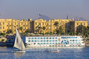 Egypt, Luxor, View of Nile cruise boats infront of The Winter Palace Hotel Egypt, Luxor, View of Nile cruise boats infront of The Winter Palace Hotel