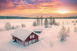 Finland Collection: Europe, Finland, Rovaniemi, aerial view of a frozen lake near Rovaniemi with traditional red