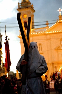 Europe, Malta, Qormi; A caped cross bearer walking barefoot during the Good Friday Processions Europe, Malta, Qormi; A caped cross bearer walking barefoot during the Good Friday Processions