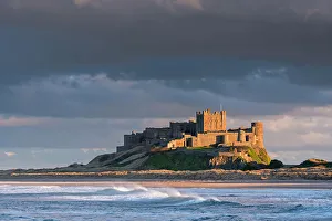 Prints of Evening sunlight on Bamburgh Castle, Northumberland, England. Spring (March) 2015 Northumberland Prints: Evening Sunlight Print on Bamburgh Castle