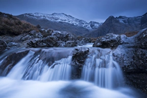 Fairy Pools waterfalls at Glen Brittle, with the snow dusted Cuillin mountains beyond Fairy Pools waterfalls at Glen Brittle, with the snow dusted Cuillin mountains beyond