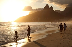 The famous Ipanema Beach in Rio de Janeiro with the Two Brothers Mountain in the background at sunset The famous Ipanema Beach in Rio de Janeiro with the Two Brothers Mountain in the background at sunset