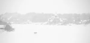 Fishermen on the frozen Volkhov River with Nikolsky monastery in the background, Staraya Fishermen on the frozen Volkhov River with Nikolsky monastery in the background, Staraya