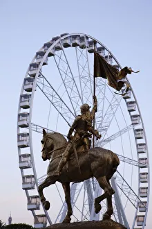 France, Paris, Place des Pyramides, Statue of Joan of Arc and Carousel France, Paris, Place des Pyramides, Statue of Joan of Arc and Carousel