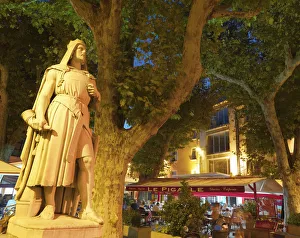 France, Provence, Orange, Place de la Republic, Rimbaud 11 statue at dusk France, Provence, Orange, Place de la Republic, Rimbaud 11 statue at dusk